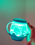 Mini Sensory Jar Glo Pals bleu qui s'illumine au contact de l'eau, lumière turquoise douce