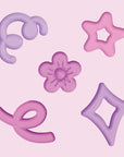 Fillers en silicone roses et violets Glo Pals, fleur, étoile, losange et boucles pour jouer dans le bocal